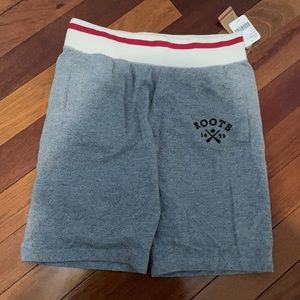 Never worn men’s roots shirts